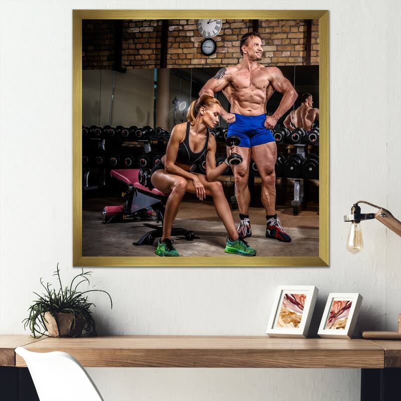 Designart "Sports Couple Is Working Out Gym" Aerobic & Bodybuilding Framed Canvas Prints - 16 in. wide x 16 in. high - Gold