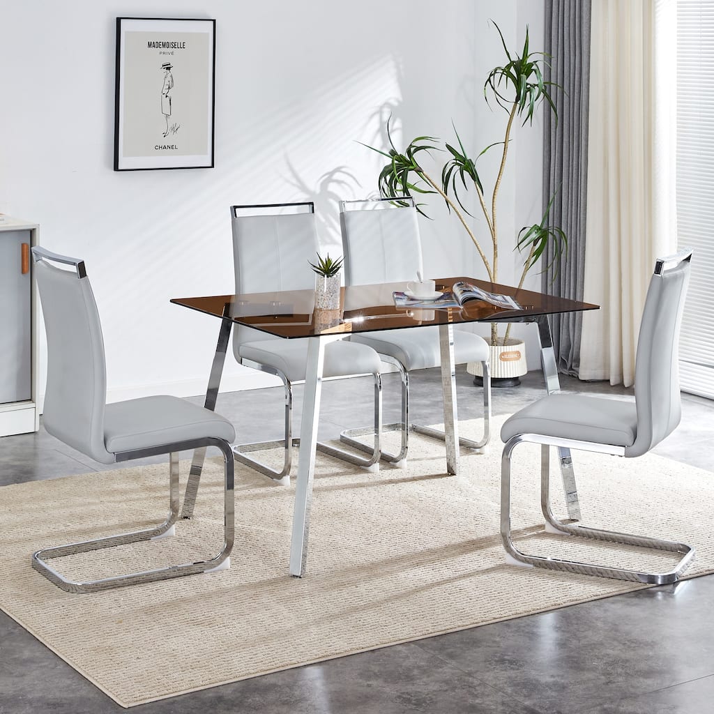 1 table and 4 chairs,tempered glass tabletop and metal legs, rectangular glass dining table,paired with 4 silver leg chairs.