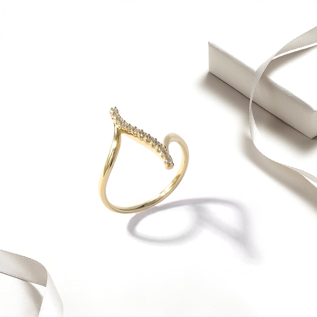 1/6ct TDW Diamond Curve Bypass Fashion Ring in 10k Gold for Women