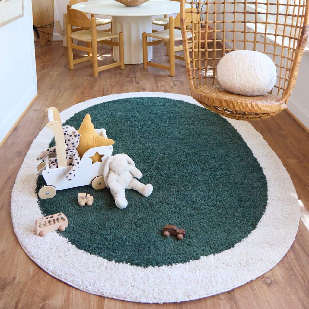 Odelle Solid Border Area Rug