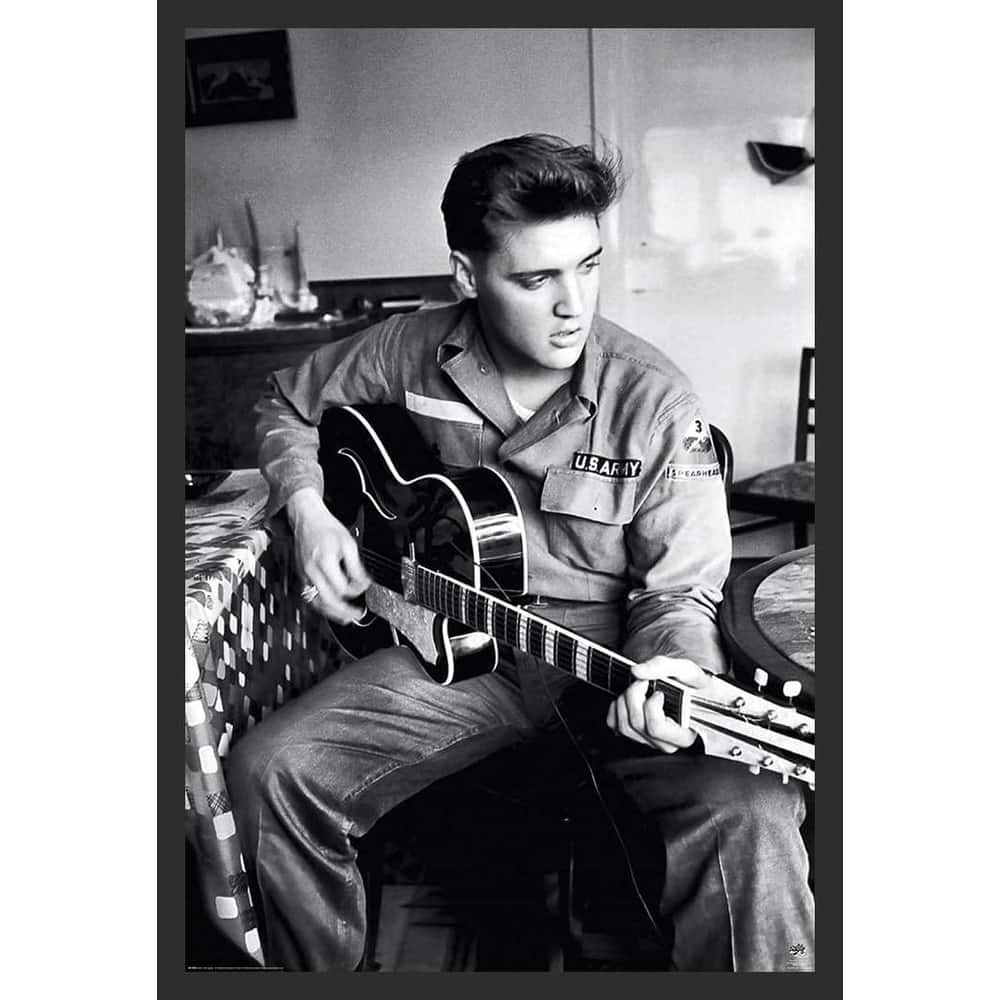 Elvis in Army with Guitar Black & White Framed Poster - 24 x 36 Inch