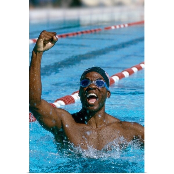 "A young male swimmer raising his hands in victory" Poster Print