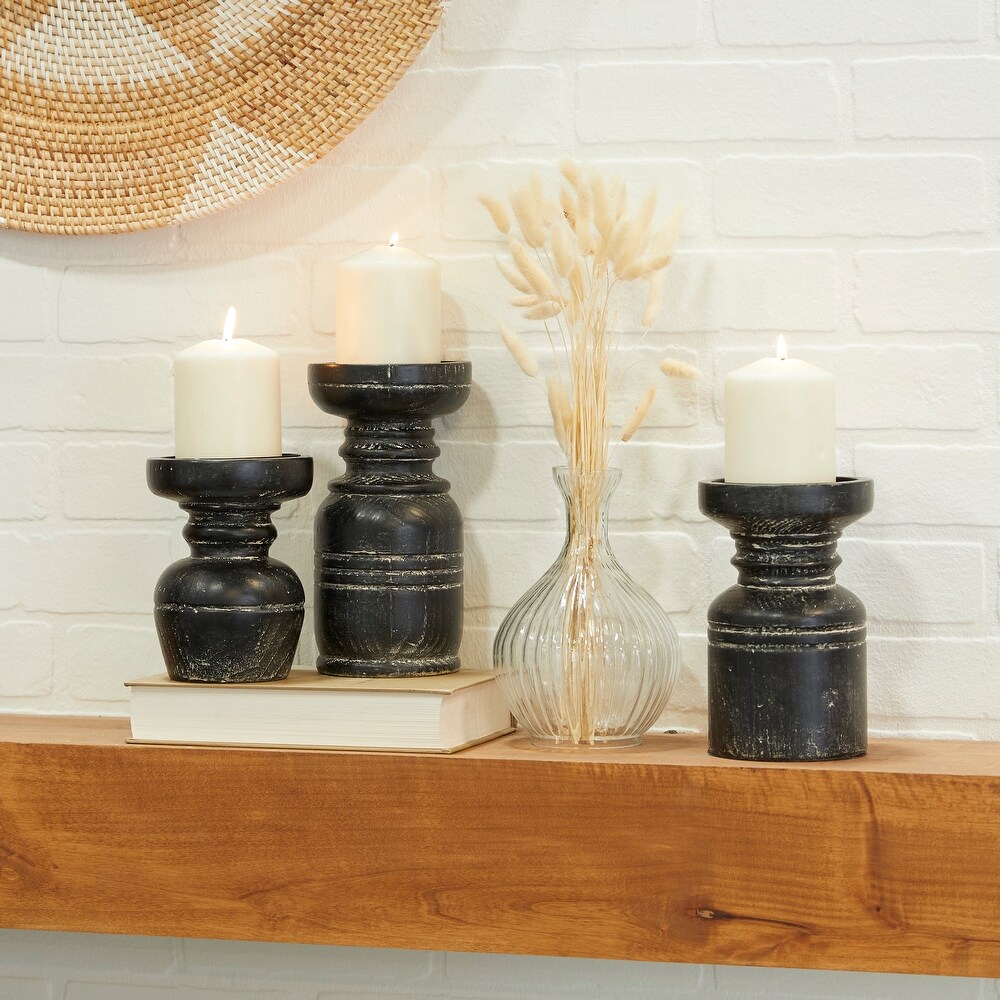 https://ak1.ostkcdn.com/images/products/is/images/direct/ec11acf158a7bcb9fc82255cd6b4724ad5a4e9e3/Black-Wood-Traditional-Candle-Holder-%28-Set-of-3%29.jpg