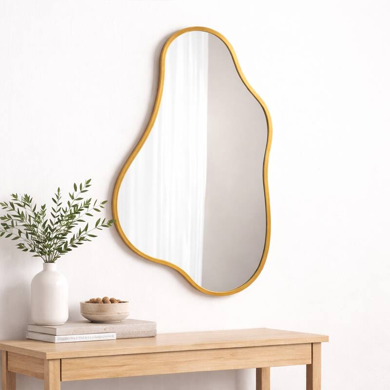 A modern-style, irregularly shaped wall-mounted mirror with a gold frame, suitable for a dressing table or bathroom