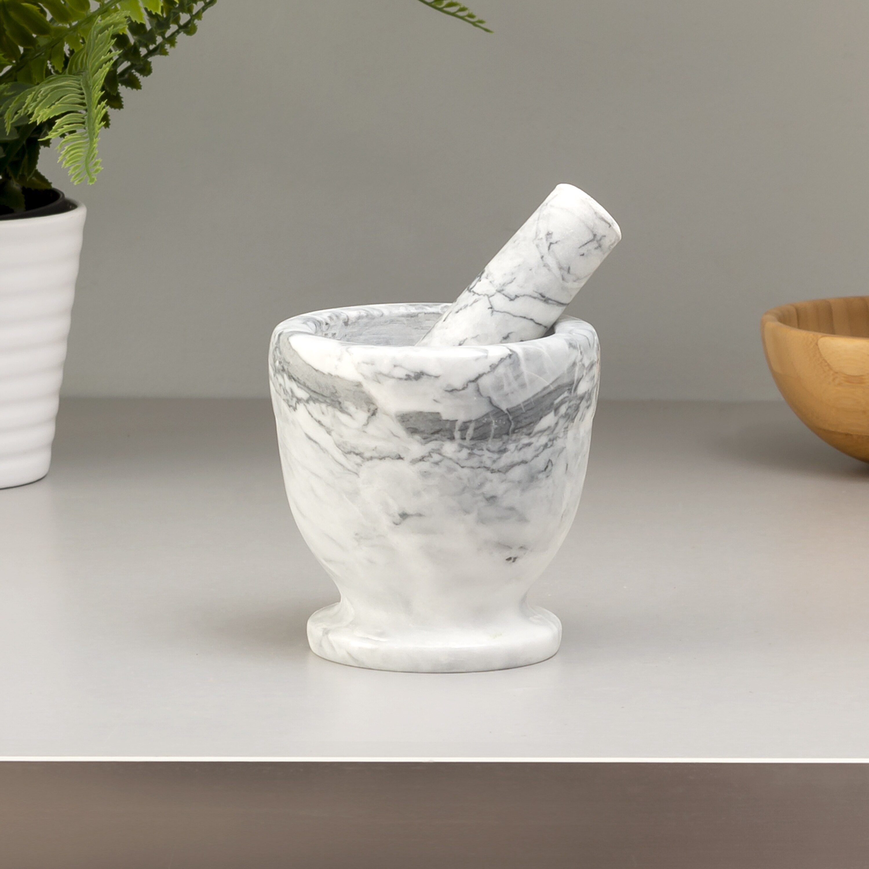 https://ak1.ostkcdn.com/images/products/is/images/direct/ec95a7a44fc6fecd3c63fb5c288c795ffb740200/Premius-Marble-Mortar-and-Pestle.jpg