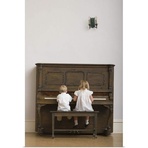 "Girl and boy sitting on bench playing piano, rear view" Poster Print