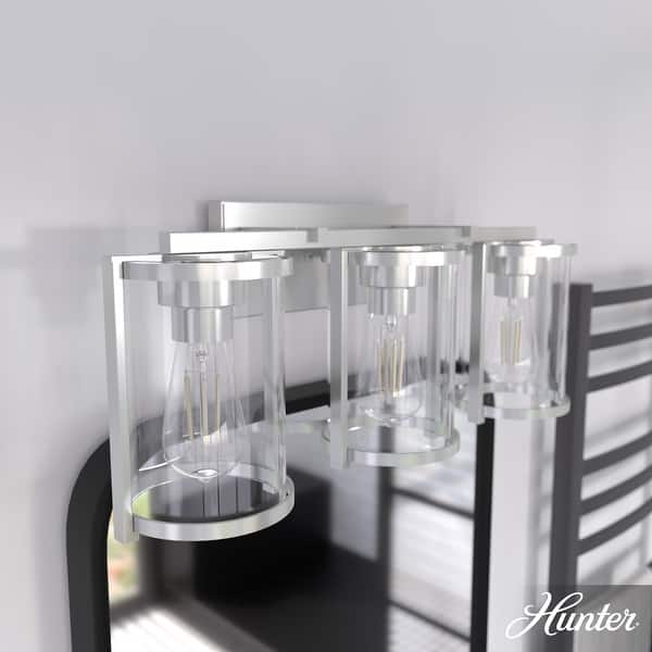slide 2 of 12, Hunter Astwood Bathroom Vanity Light, Clear Cylinder Glass, Damp Rated, Caged - Contemporary, Transitional, Art-Deco 3-Light 24" - Brushed Nickel