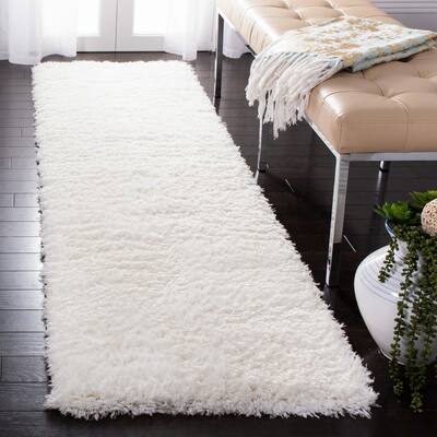 SAFAVIEH Flokati Vojsava Shag Solid Rug