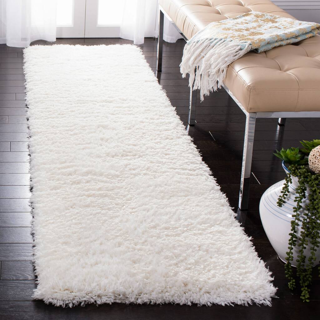 SAFAVIEH Flokati Vojsava Shag Solid Rug