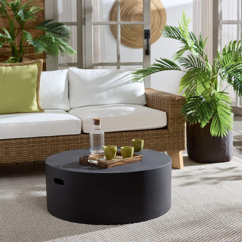 SAFAVIEH Outdoor Patio Furniture Georgia Round Coffee Table, Modern Sculptural Outdoor Table, Durable Low Profile Design