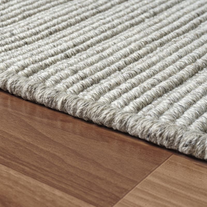 Sevita Solid Casual Hand-Woven Woolen Area Rug