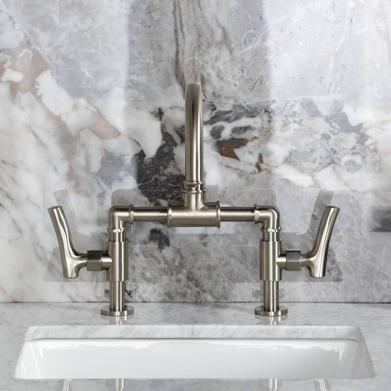 Kingston Brass Hallerbos Two-Handle 4-Hole Deck Mount Bridge Bathroom Faucet with Brass Pop-Up Drain