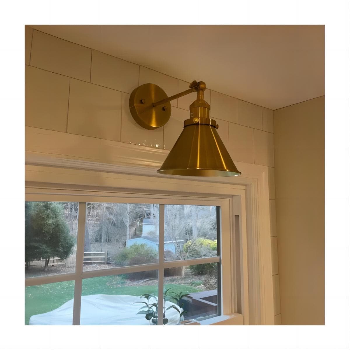 Brass cone wall light top
