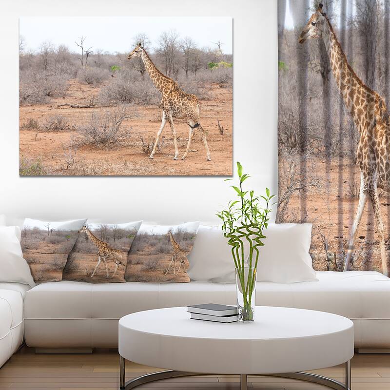 Designart "Giraffe Walking through African Forest" Modern Animal Canvas Wall Artwork Print - 40 in. wide x 30 in. high - 1 Panel