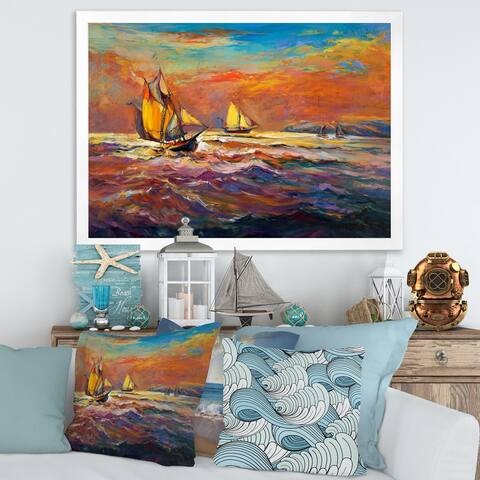 Designart 'Sailships on The Ocean Waves During Orange Sunset' Nautical & Coastal Framed Art Print