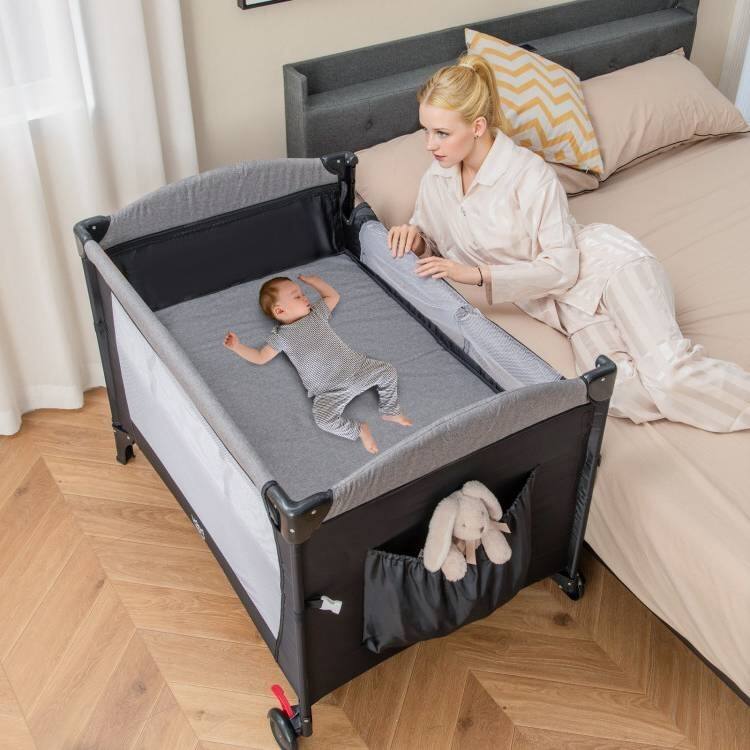 5-in-1 Infant Bed Cradle Changing Table with Side Storage and Music Rack Safety Strap - 43" x 29.5" x 32.5" (L x W x H)