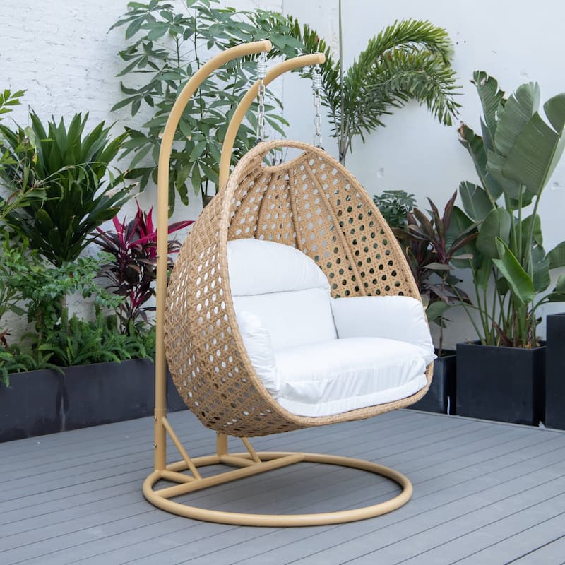 LeisureMod Mendoza 2-Person Hanging Egg Swing Chair - Handcrafted Light Brown Wicker, Patio Hammock Lounger with Cushions - 53"