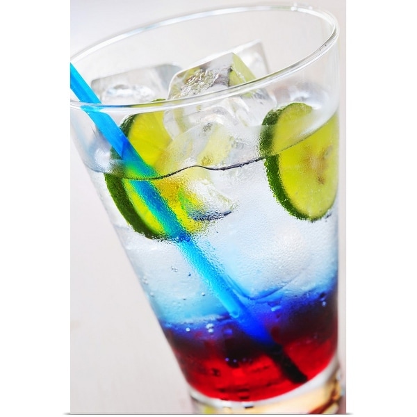 "Coloured soft drink with ice cubes and lime slices, close-up" Poster Print