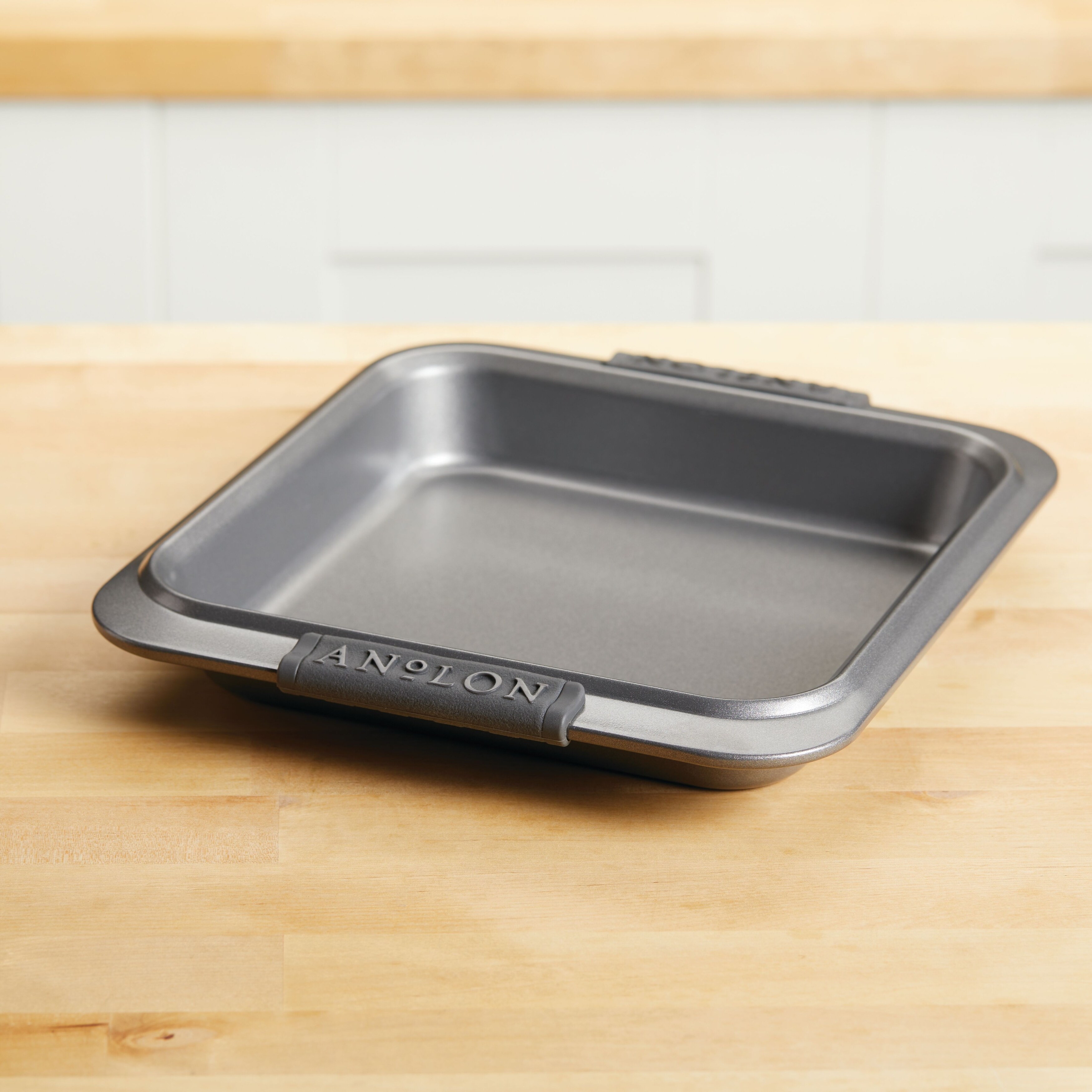 https://ak1.ostkcdn.com/images/products/is/images/direct/ef424331c1075f597bfd141d8bf1bea8a7dffbe1/Anolon-Advanced-Bakeware-Nonstick-Square-Cake-Pan%2C-9-Inch-x-9-Inch%2C-Gray.jpg