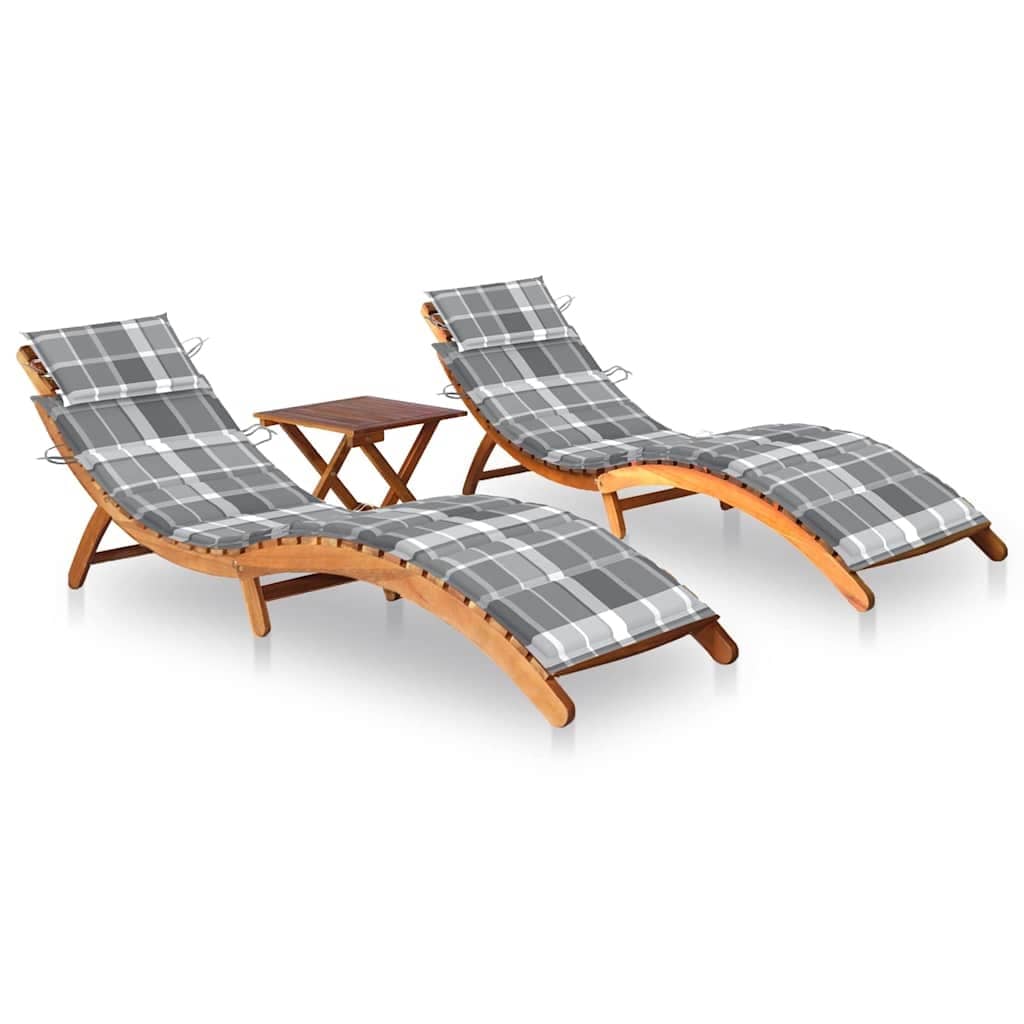 Two gray plaid sun loungers with small wooden table