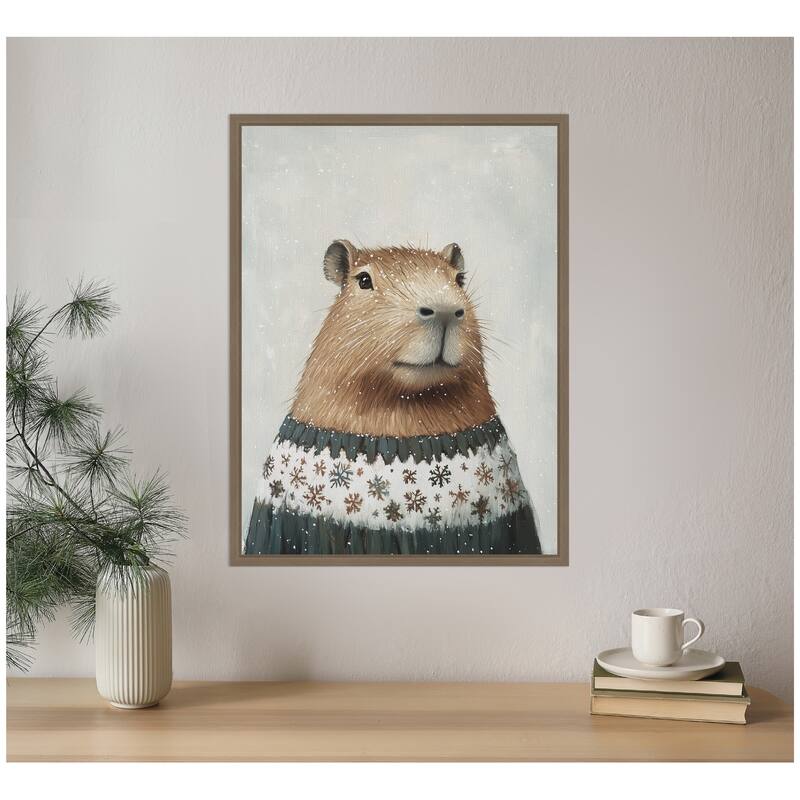 Kate and Laurel Sylvie Framed Canvas Capybara in Winter Snowflake Sweater by The Creative Bunch Studio