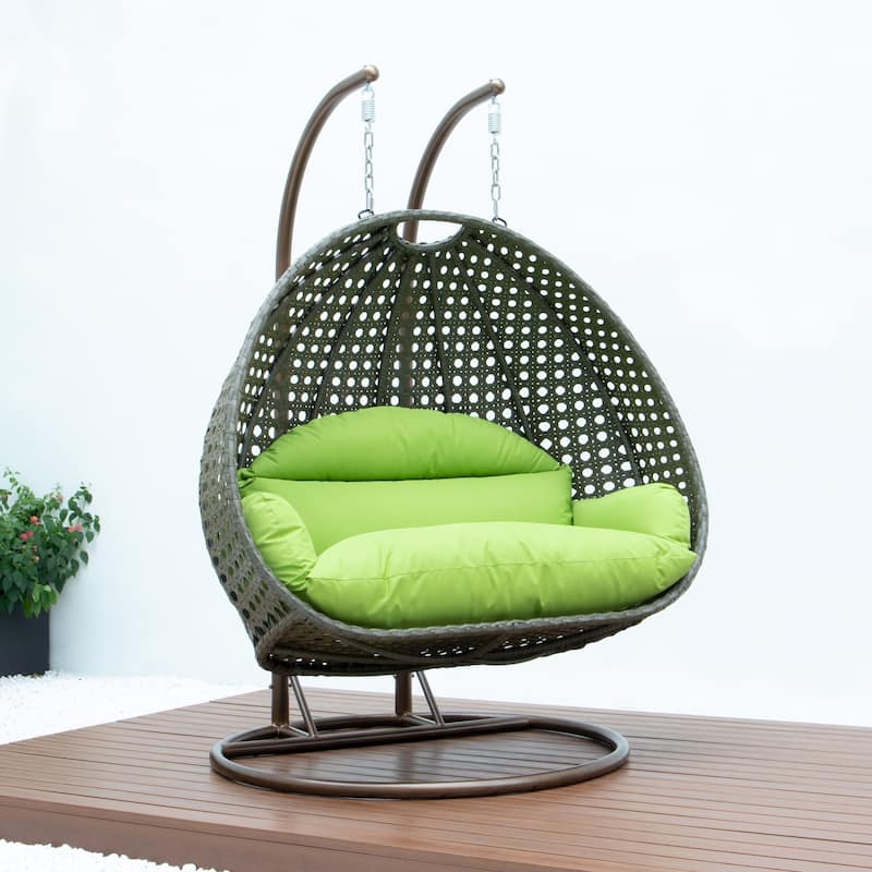 LeisureMod 2-Person Hanging Egg Swing Chair with Metal Stand - Handcrafted Beige Wicker, Patio Hammock Lounger with Cushions
