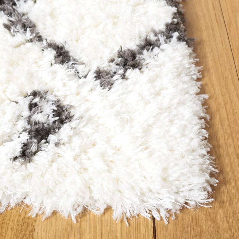 SAFAVIEH Handmade Flokati Theresie Shag Solid Polyester Rug