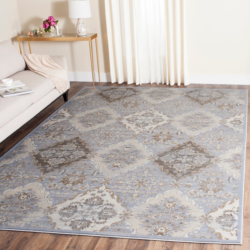 SAFAVIEH Vintage Distressed Boho Leota Oriental Rug - 6'7" x 9'2" - Light Blue/Ivory