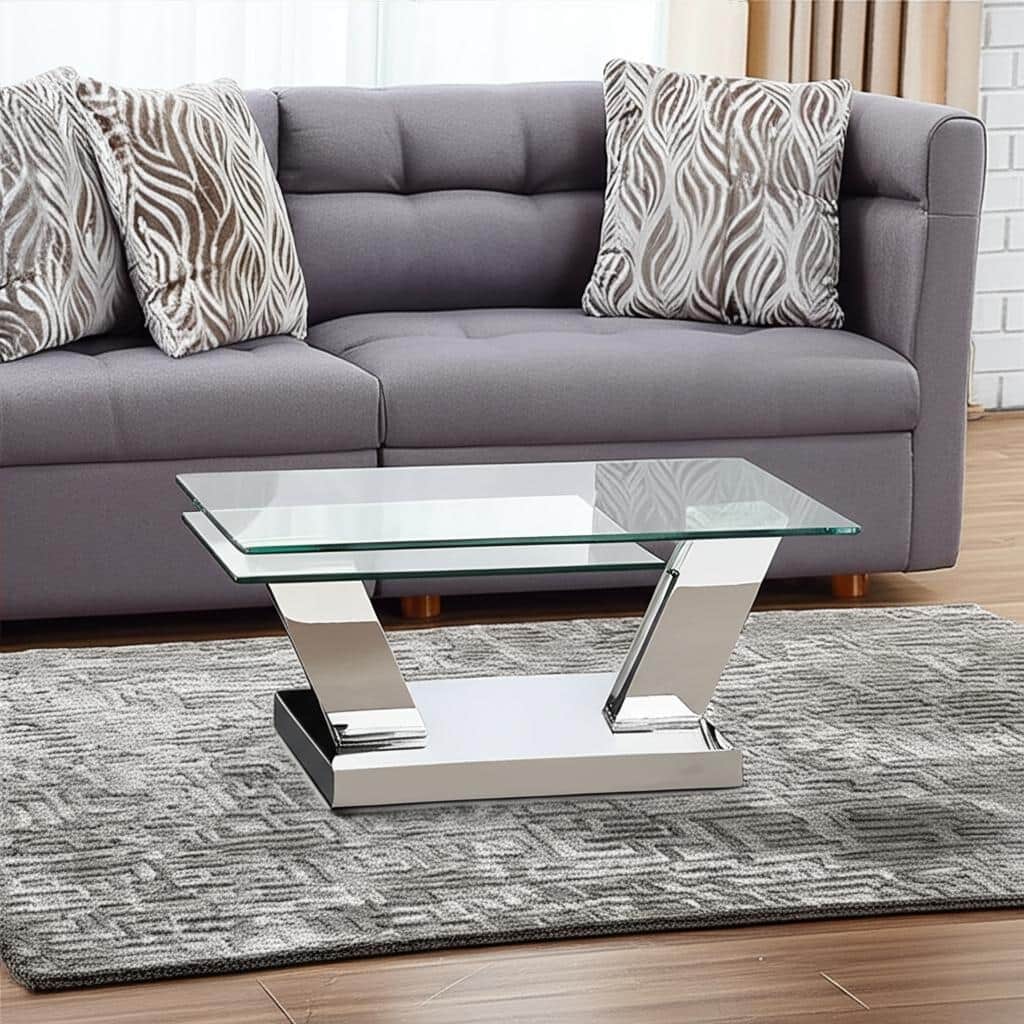HomeRoots 32" Clear And Silver Glass And Stainless Steel Floor Shelf Coffee Table - 31.5 in. x 17 in. x 23.5 in.