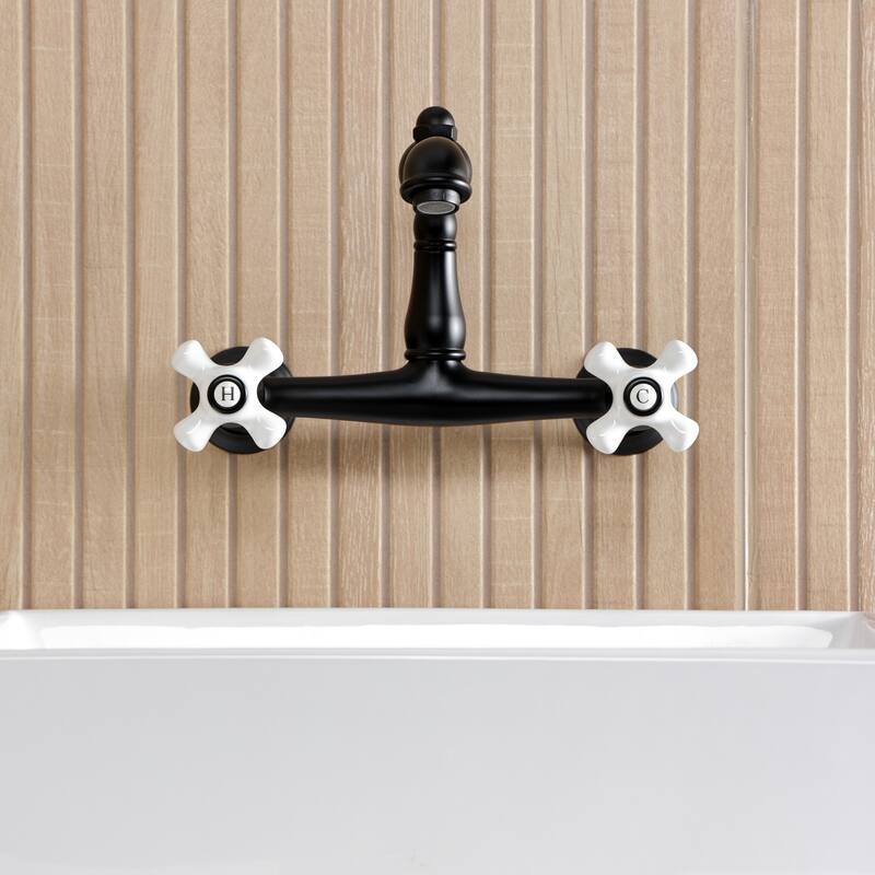 Kingston Brass English Country Two-Handle 2-Hole Wall Mount Bathroom Faucet