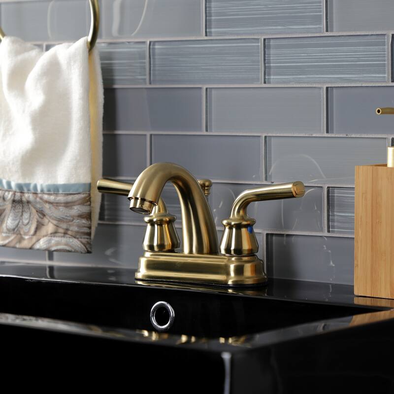 Kingston Brass Restoration Two-Handle 3-Hole Deck Mount 4" Centerset Bathroom Faucet with Plastic Pop-Up