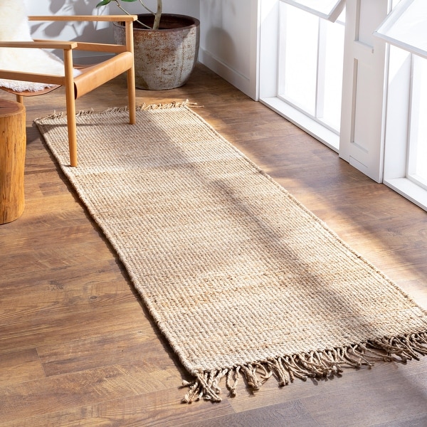 The Gray Barn Flynn Hand-woven Jute Fringed Area Rug. Opens flyout.