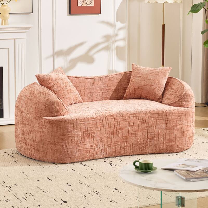 Curved 2 person compress sofa. It has armrests on both sides, comes with two pillows,is suitable for small - sized apartments