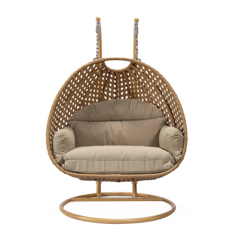 LeisureMod Mendoza 2-Person Hanging Egg Swing Chair - Handcrafted Light Brown Wicker, Patio Hammock Lounger with Cushions - 53"