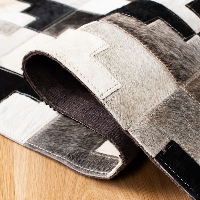 SAFAVIEH Handmade Studio Leather Rengin Modern Leather Rug