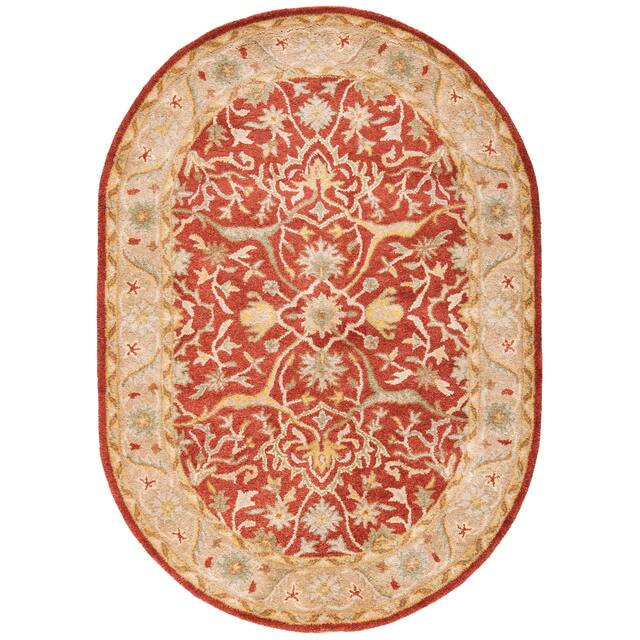 SAFAVIEH Handmade Antiquity Izora Traditional Oriental Wool Rug - 7'6" x 9'6" Oval - Rust