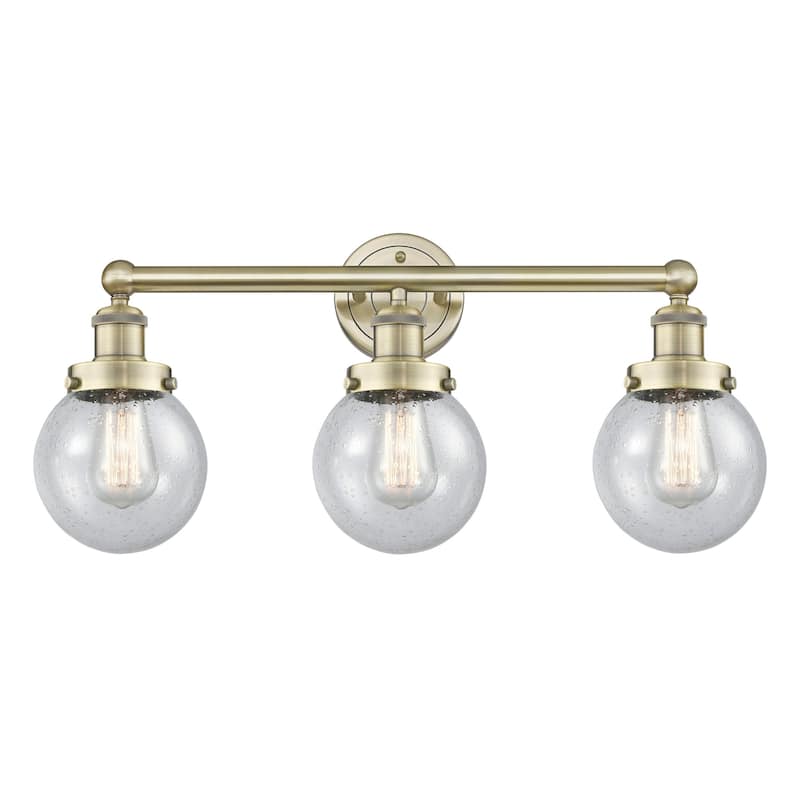 Innovations Lighting 616-3W-10-25 Beacon Vanity Beacon 3 Light 25" - Antique Brass / Seedy / Multi-Colored
