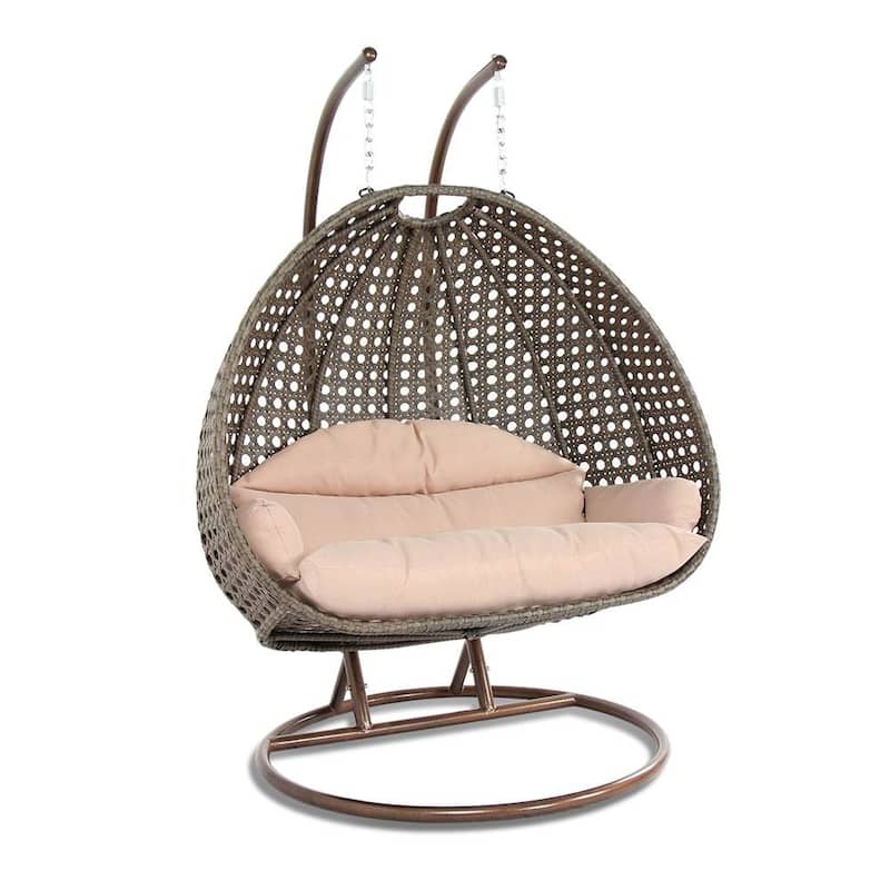 LeisureMod 2-Person Hanging Egg Swing Chair with Metal Stand - Handcrafted Beige Wicker, Patio Hammock Lounger with Cushions