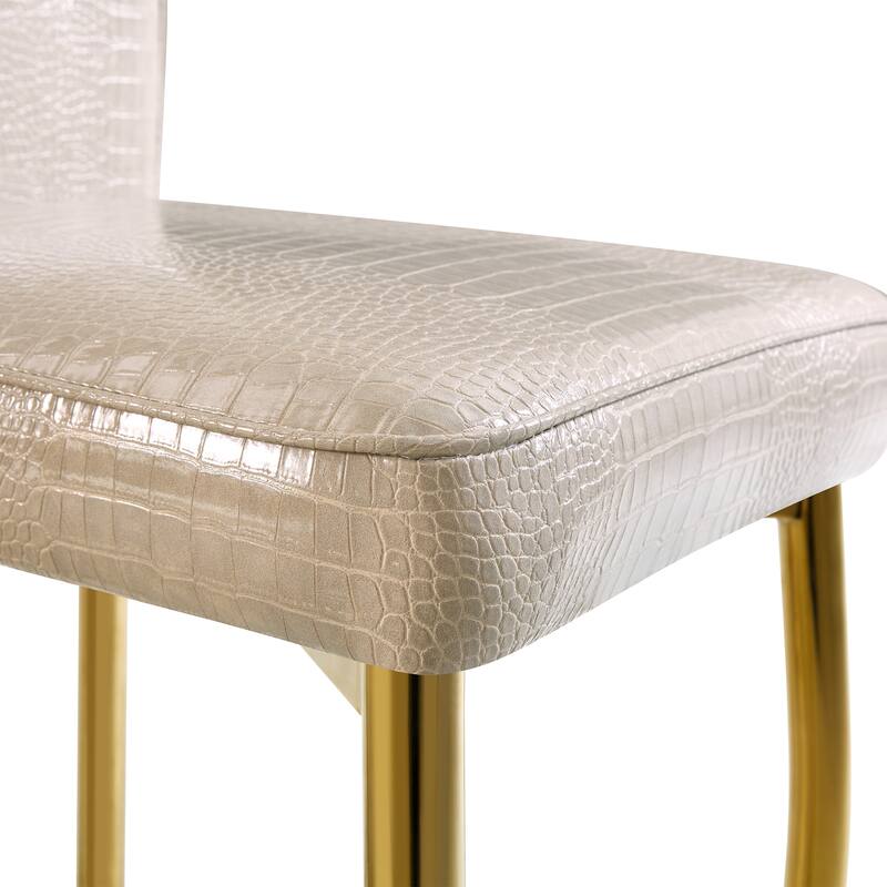 A set of 2 vintage crocodile leather cushioned dining chairs, featuring crystal clasp design and artificial leather design