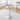 A glass tabletop with a diameter of 35 inches and a modern minimalist circular dining table with electroplated metal legs