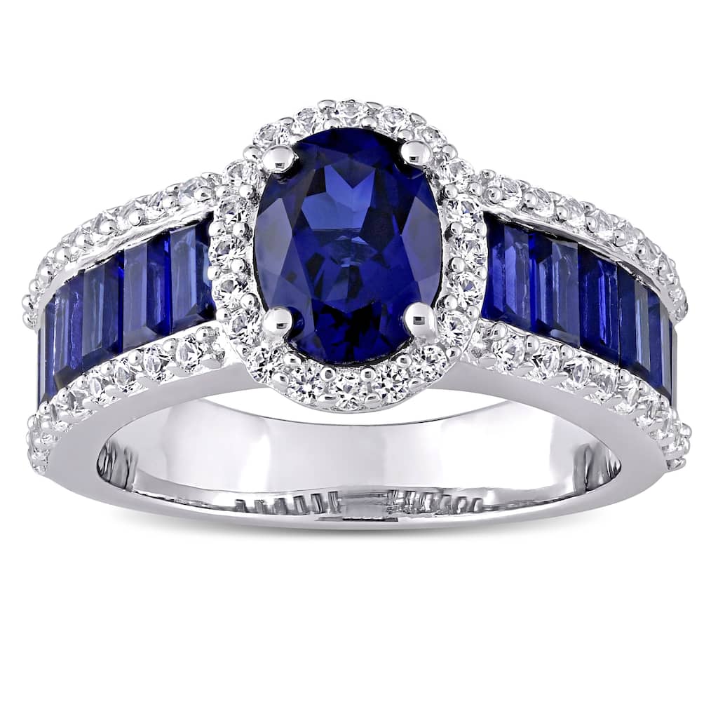 Oval & Baguette-cut Created Blue and White Sapphire Halo Engagement Ring in Sterling Silver by Miadora