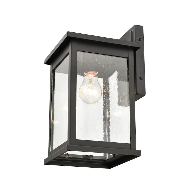 Millennium Lighting Bowton 1 Light Outdoor Wall Sconce in Powder Coat Black with Clear Glass Shade