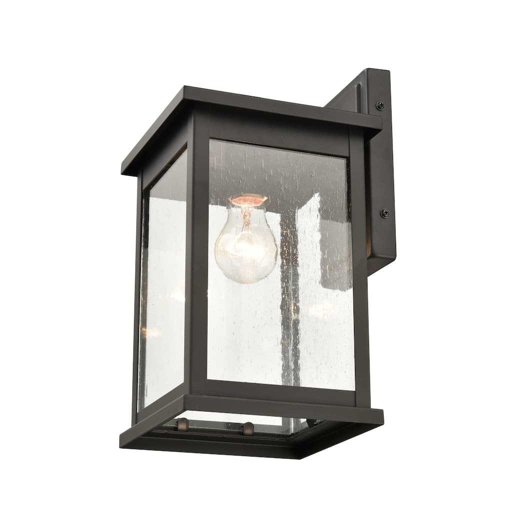 Millennium Lighting Bowton 1 Light Outdoor Wall Sconce in Powder Coat Black with Clear Glass Shade