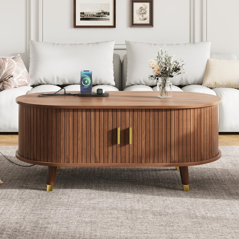42.5" Mid-Century Oval Coffee Table – Solid Wood Fluted Design with Sliding Tambour Door & Built-In Charging Station. - Walnut
