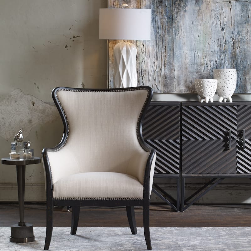 21.75" bronzed metal cylindrical accent table on a gray concrete base