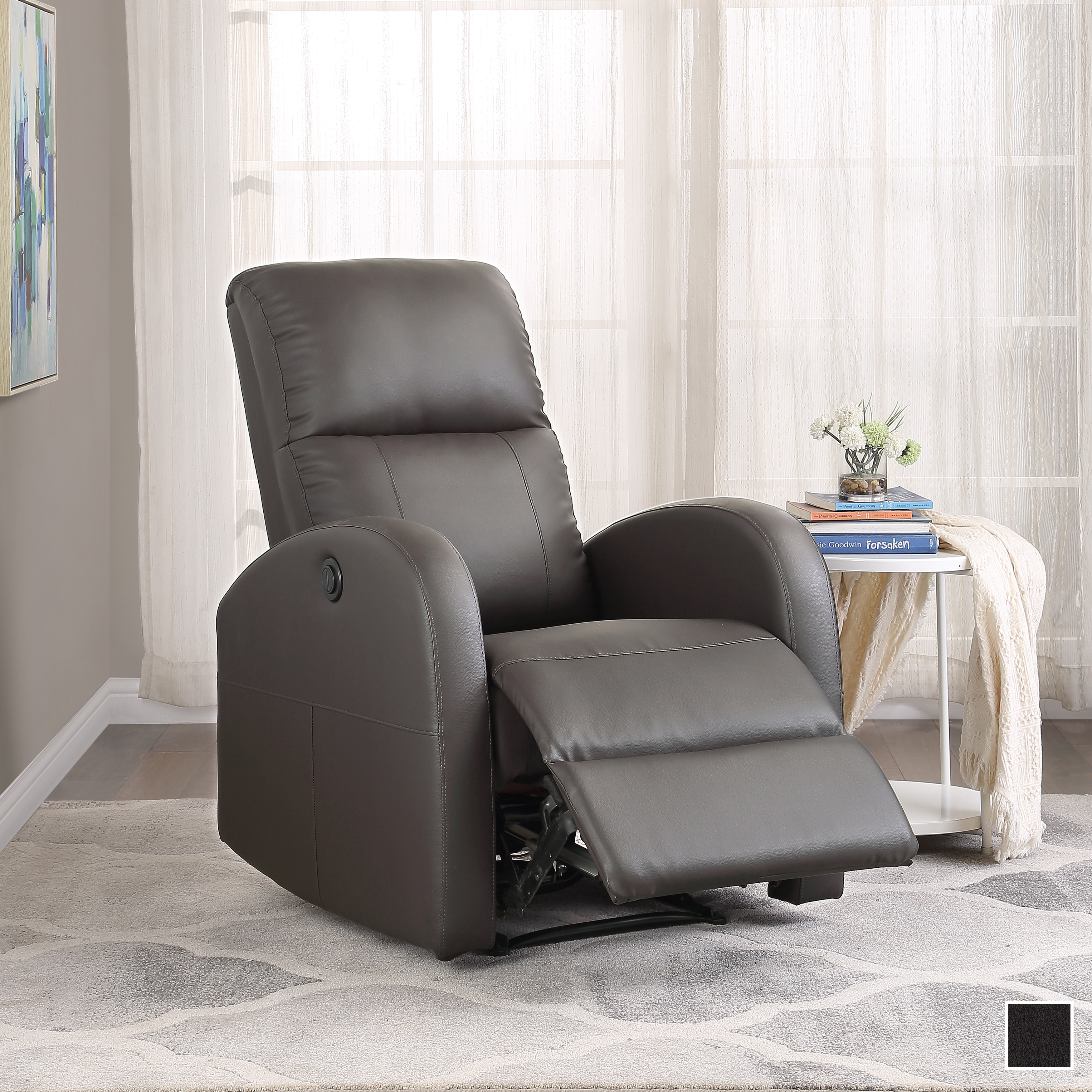 A dark brown/gray recliner chair in a living room, with footrest extended, on a light patterned rug