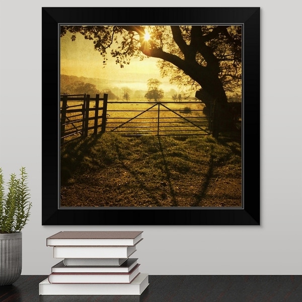 "Fence at sunset, reflection of fence on soil." Black Framed Print
