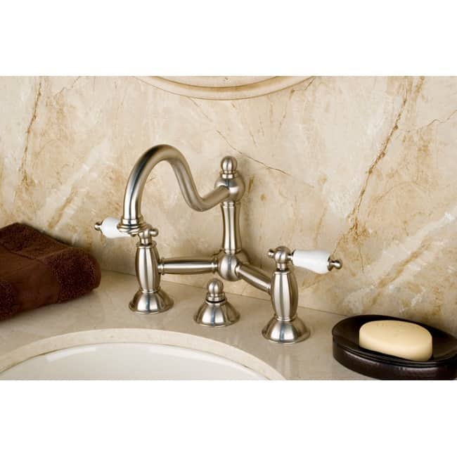 Kingston Brass Restoration Bridge Bathroom Faucet with Pop-Up Drain