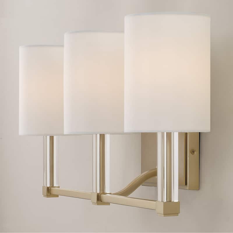 24" W x 9.75" H 3-Light Vanity in Matte Brass with Clear Acrylic Accents and Cylindrical White Fabric Shades