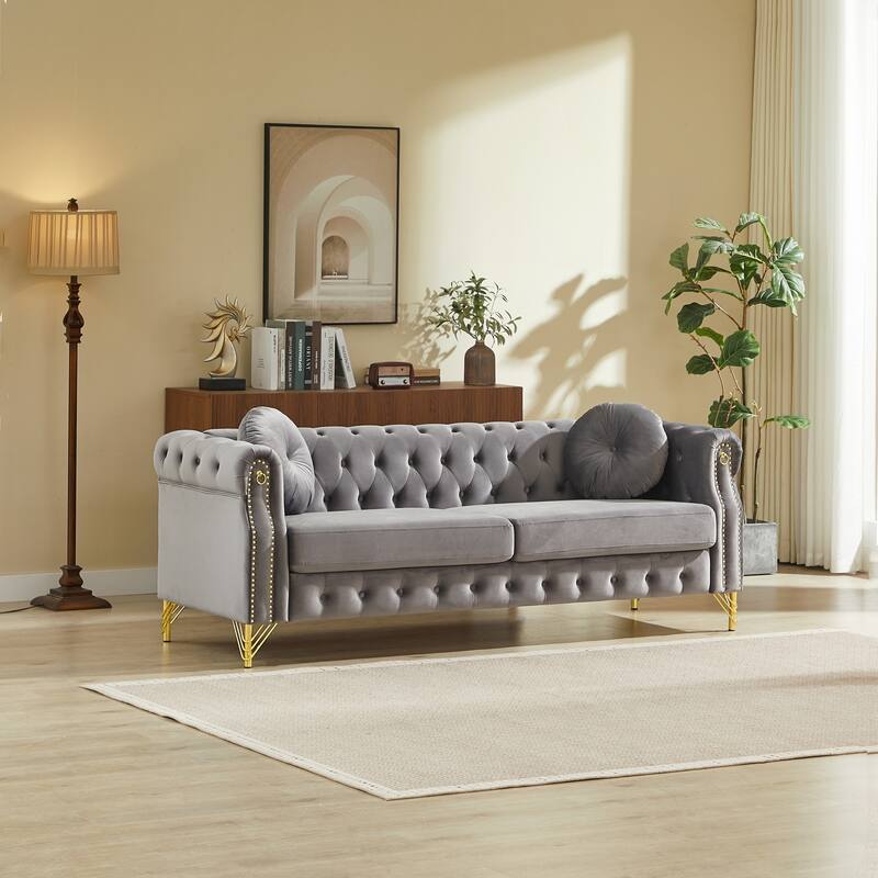Chesterfield Sofa with Two Round Pillows, Featuring Copper Stud Detailing and Tufted Button Accents